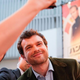 Alden Ehrenreich takes a selfie with a fan on the red carpet.